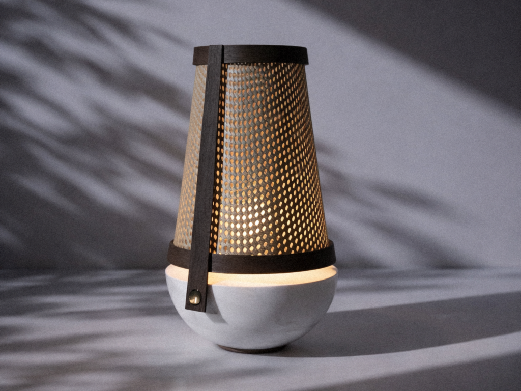 robusta table lamp with light on, showing shadows and material contrast